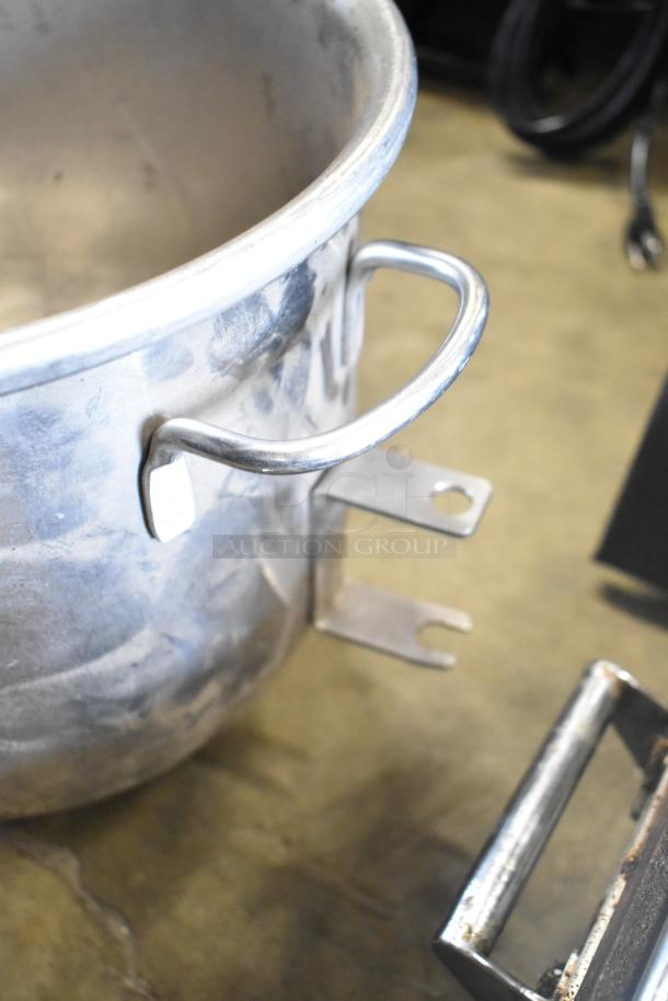 Set of two commercial mixing bowls and two paddle attachments. Durable stainless steel, suitable for heavy-duty use.