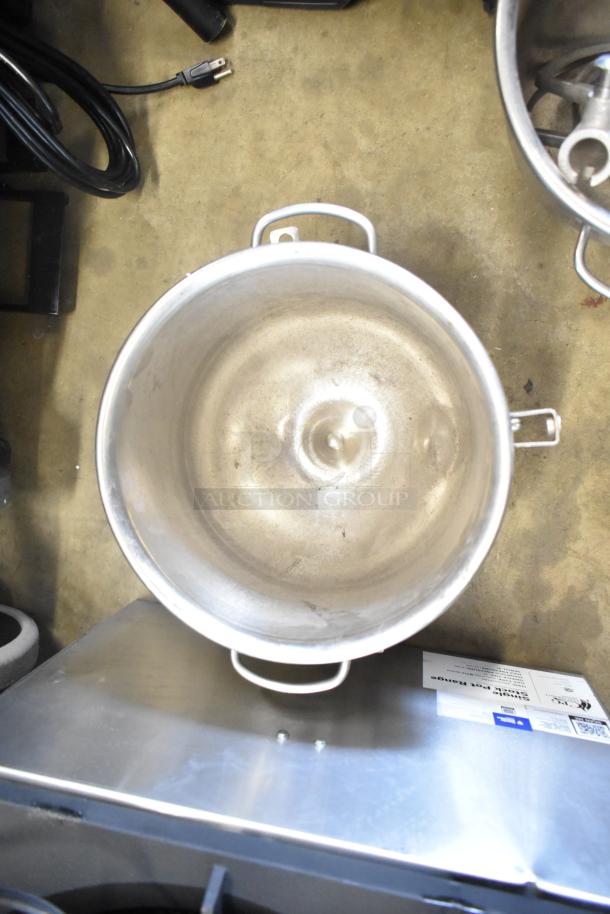 Four commercial kitchen items: two stainless steel mixing bowls and two paddle attachments, good condition.