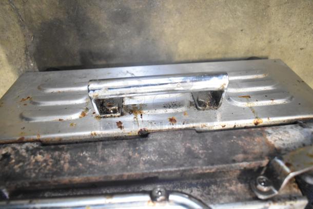 Waring WPG300 Commercial Double Panini Press, 240V, showing signs of use with visible rust and wear on the metal surface.