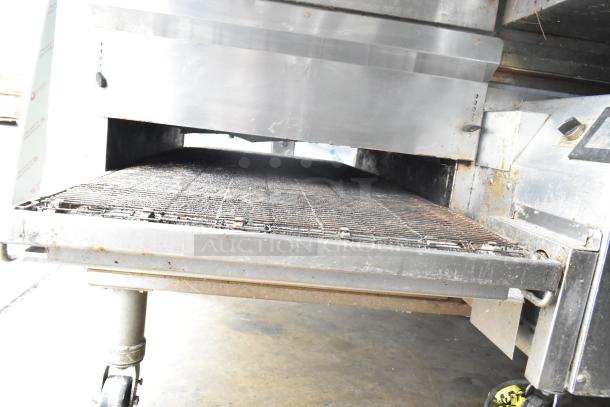 Middleby Marshall PS638G conveyor pizza oven, 2021 model on casters, natural gas-powered, showing conveyor tray detail.