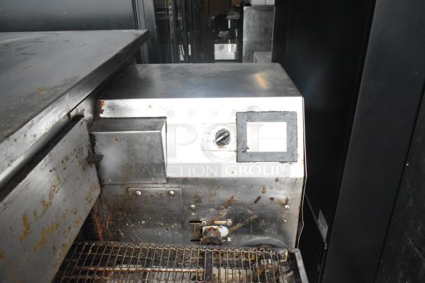Middleby Marshall PS638G commercial conveyor pizza oven, natural gas, visible wear, 89,000 BTU, on commercial casters.