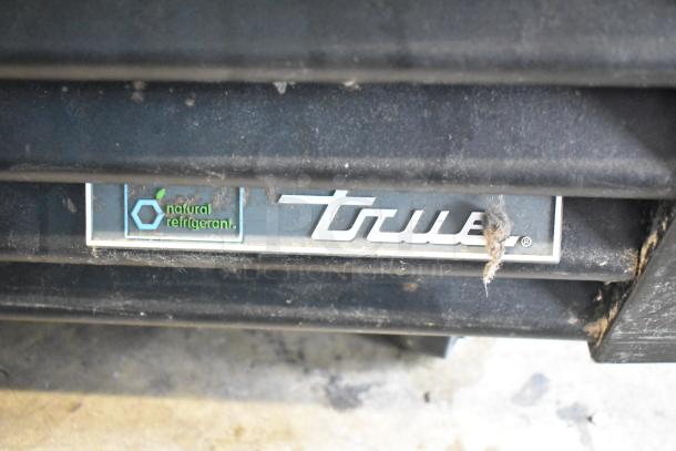 2017 True GDM-72F-HC commercial freezer label, "natural refrigerant" mention, used condition, visible wear.