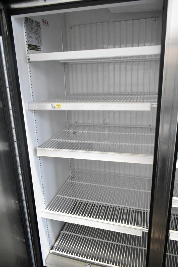 2017 True GDM-72F-HC 3 Door Reach In Freezer Merchandiser, shelves visible, clean condition, 115/208-230V, 1 Phase.