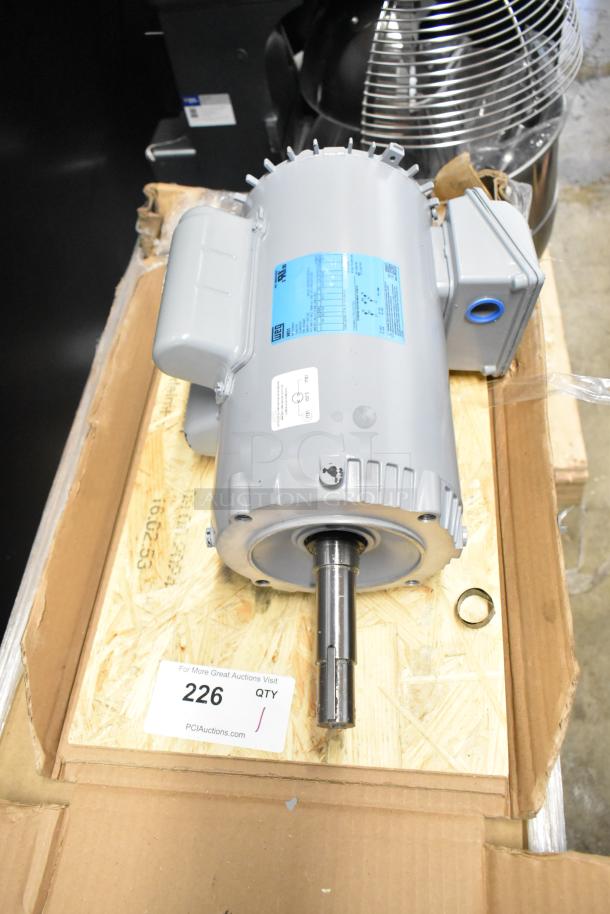 Brand new 2025 Weg Z00218ET1C052721 motor, 230 volts, scratch and dent. Includes blue label with specs, seen in open box.