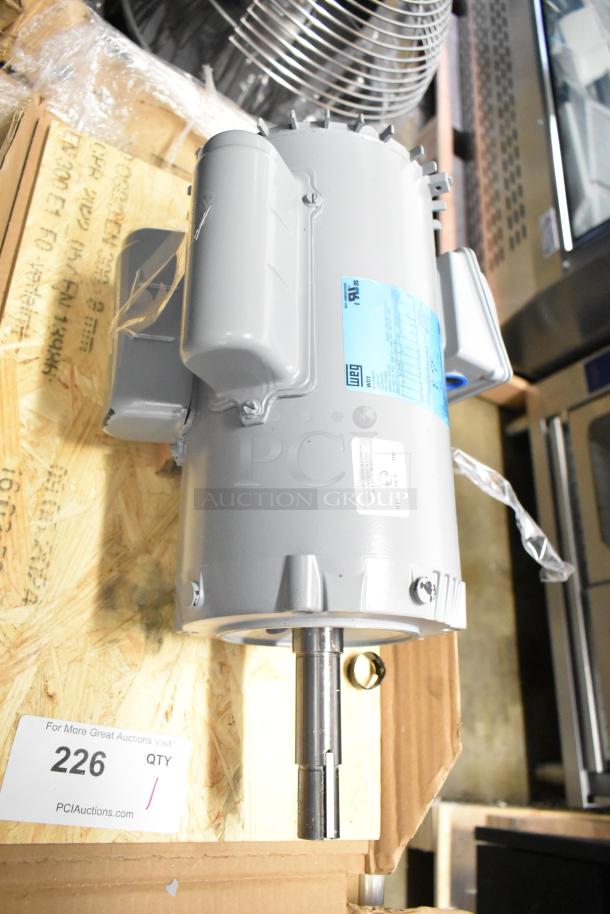 Brand new 2025 Weg Z00218ET1C052721 motor, 230 volts. Scratch and dent condition, visible marking and label details.