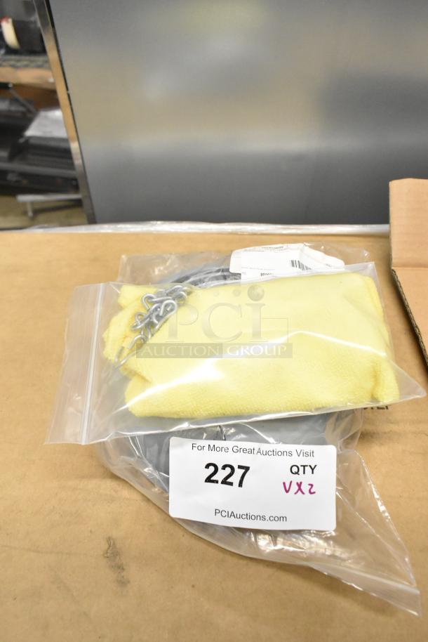 Brand new chain and cover set, scratch and dent condition, in sealed packaging. Auction tag number 227. Quantity: 2x.