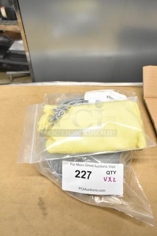 Brand new chain and cover set, scratch and dent condition, in sealed packaging. Auction tag number 227. Quantity: 2x.