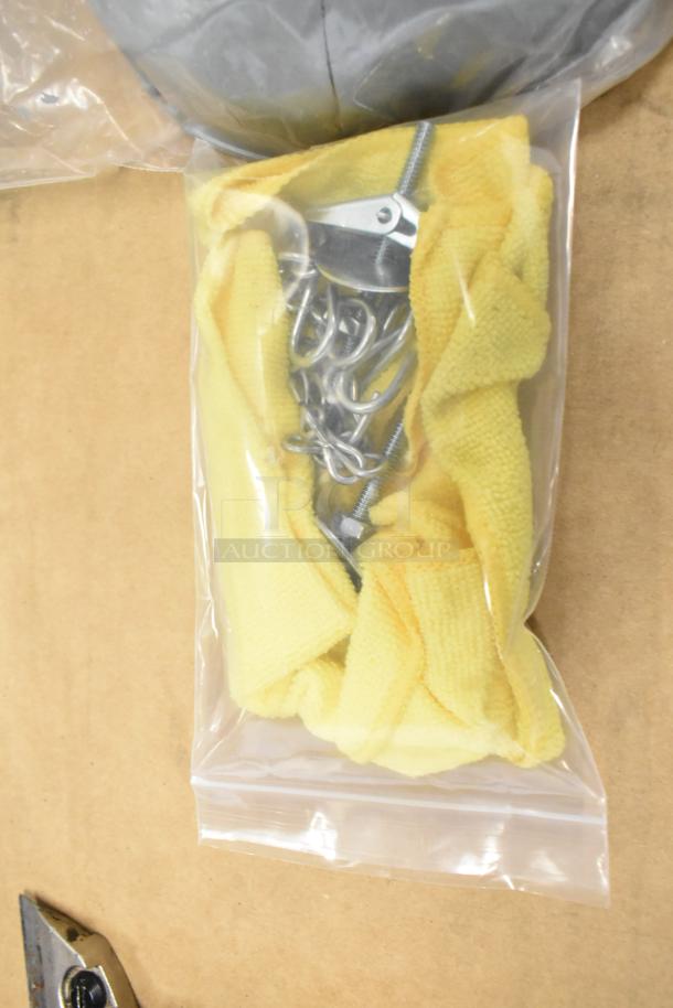New scratch and dent chain and cover set in plastic packaging with a yellow cloth. Doubling your bid on auction.