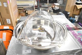 Brand new metal bowl with a clear poly lid, labeled "229 QTY VAZ" from PCIAuctions, sold as scratch and dent.