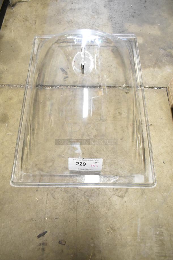 Clear poly lid with slight scratches, brand new condition, marked with auction tag 229.