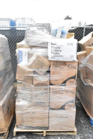 Pallet of 28 new scratch and dent items, including cutlery packs, cups, and containers, wrapped in plastic. Boxes labeled "Choice" and "Deli Lid."