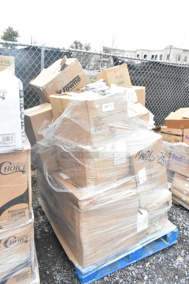 Pallet with 25 new scratch and dent items, including cutting board and towel dispenser, wrapped in plastic. Boxes marked MAR26-25.