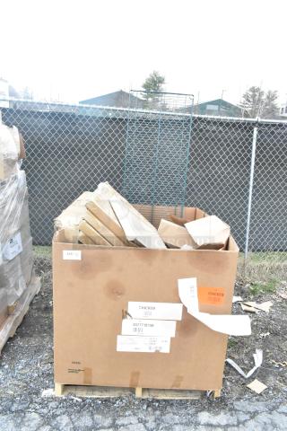 Cardboard box with scratch and dent items, including table base pieces and a waitress stand, labeled "Chicken" and "4577718150."