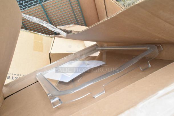 Boxes containing scratch and dent items, including table base pieces and a waitress stand, shown in open packaging.