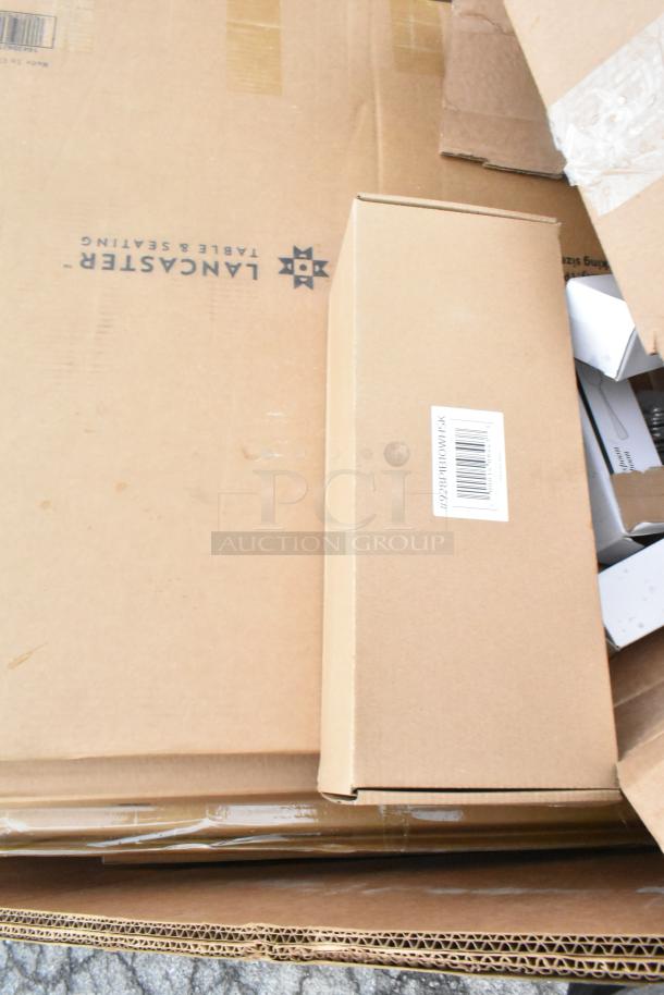 Boxes containing 17 new scratch and dent items, including Lancaster Table & Seating pieces. Visible label and barcode.