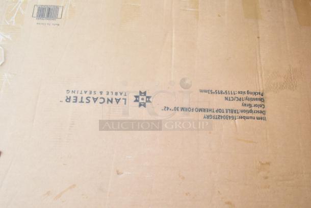 Cardboard box labeled "Lancaster Table & Seating" for table base pieces and waitress stand, brand new condition.
