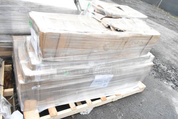 Palette with four brand new scratch and dent items, including a work table, wrapped in clear plastic. Package labeled "MAR26-16".