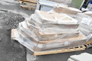Plastic-wrapped pallet of 11 new scratch and dent items including strip warmers and Regency shelves, visible labels.