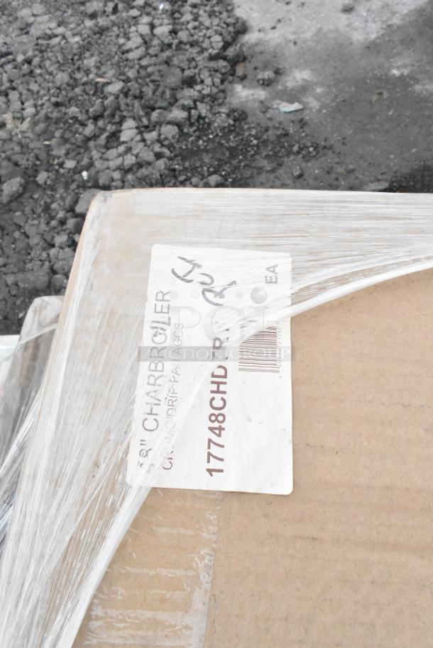 Cardboard box labeled "Charbroiler" with protective wrap, indicating brand new scratch and dent items for auction.