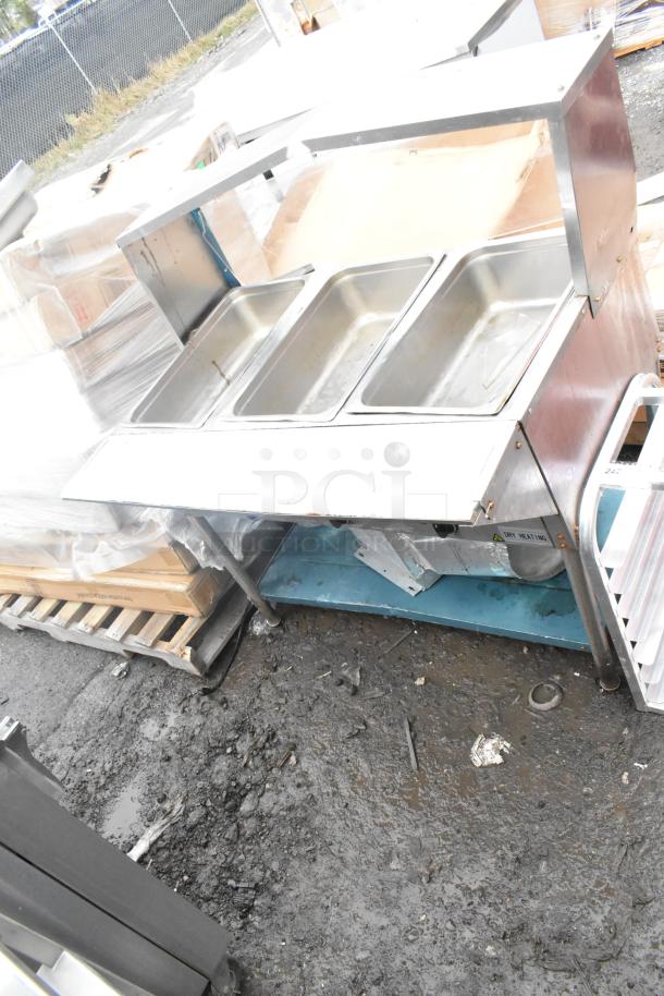 Avantco Commercial 3 Bay Steam Table, stainless steel, includes three compartments, visible wear, outdoor setting.