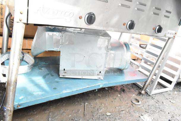 Avantco Commercial 3 Bay Steam Table with dry heating, control knobs, visible wear, and metal ducting present.