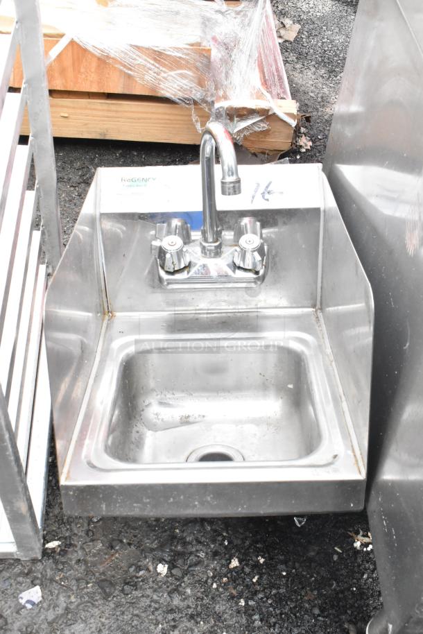 Regency 600HS12SP 12" x 16" stainless steel wall-mounted hand sink with gooseneck faucet and side splash, in used condition.