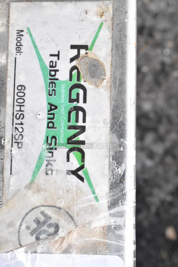 Regency wall-mounted hand sink, model 600HS12SP, with gooseneck faucet and side splash. Visible label shows brand and model.