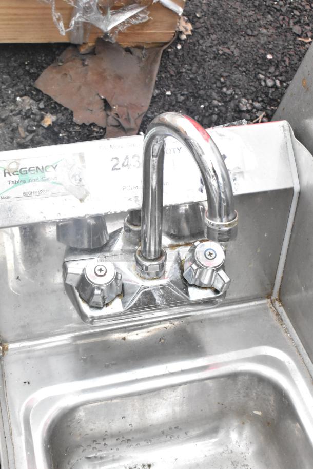 Regency 600HS12SP wall-mounted hand sink with gooseneck faucet and side splash, stainless steel, 12"x16", minor wear visible.