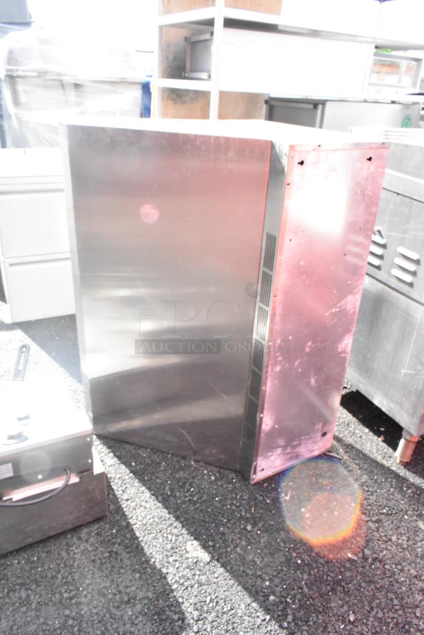 3-foot stainless steel grease hood with filters, visible surface wear, set on outdoor ground. Ideal for kitchen ventilation.