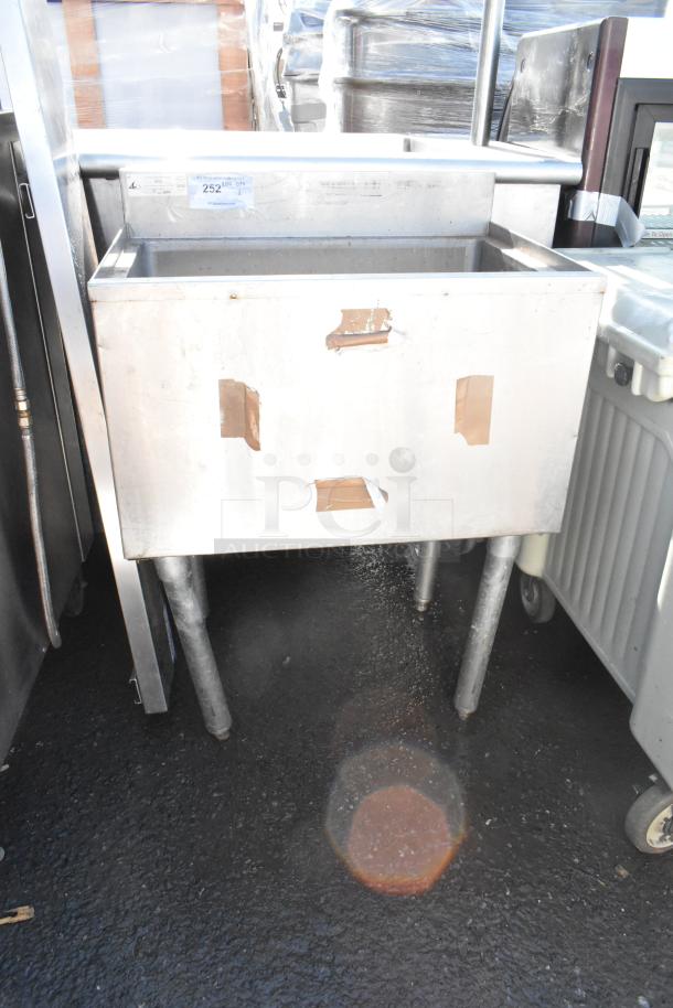 Commercial ice bin, stainless steel, used condition, standing on four legs. Secure packaging tape marks visible.