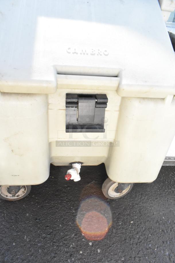 Cambro Poly Portable Ice Bin on commercial casters, features drain spout and black latch; marked "CAMBRO."