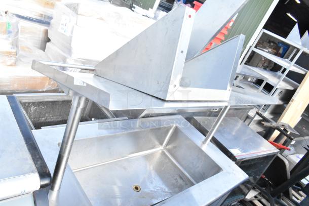 Commercial ice bin buffet station with metal construction on commercial casters, includes a drain. Suitable for catering.