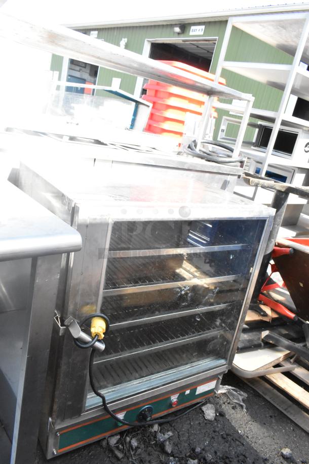 Commercial heated holding cabinet merchandiser with glass door, adjustable shelves, and commercial casters for mobility.