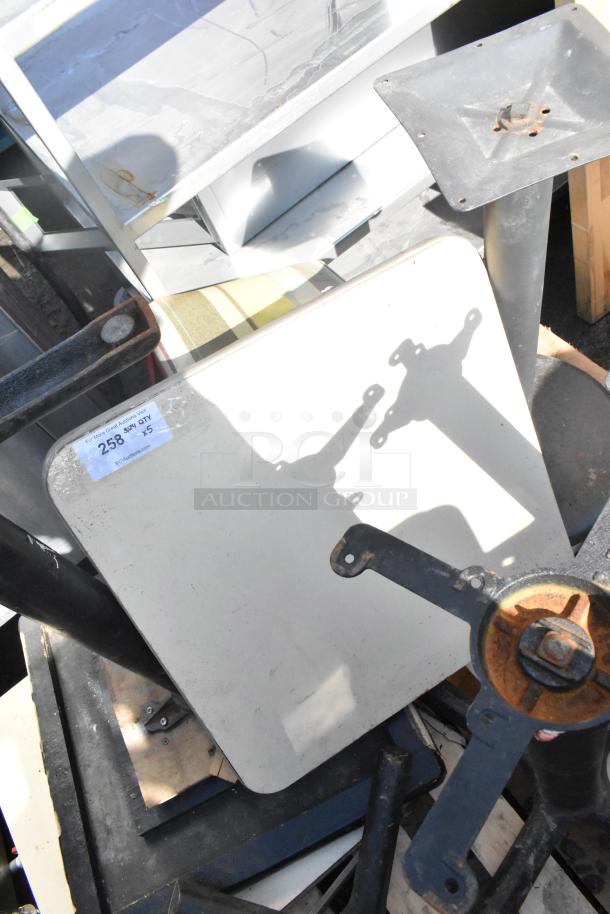 Stacked tables with metal bases, showing surface scratches and rust. Auction label reads "Lot 258 x5" for multi-bid.