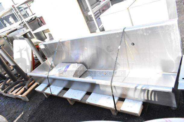 Wall-mounted Regency 600HSMSB1872 hand sink, 72"x17.5", for three single-inlet faucets. New with minor scratches.