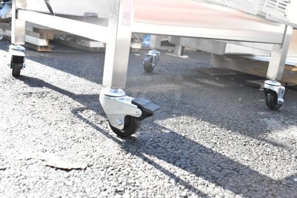 Moffat DSKE32C Dolly with commercial casters, stainless steel frame, excellent condition, suitable for heavy-duty use.