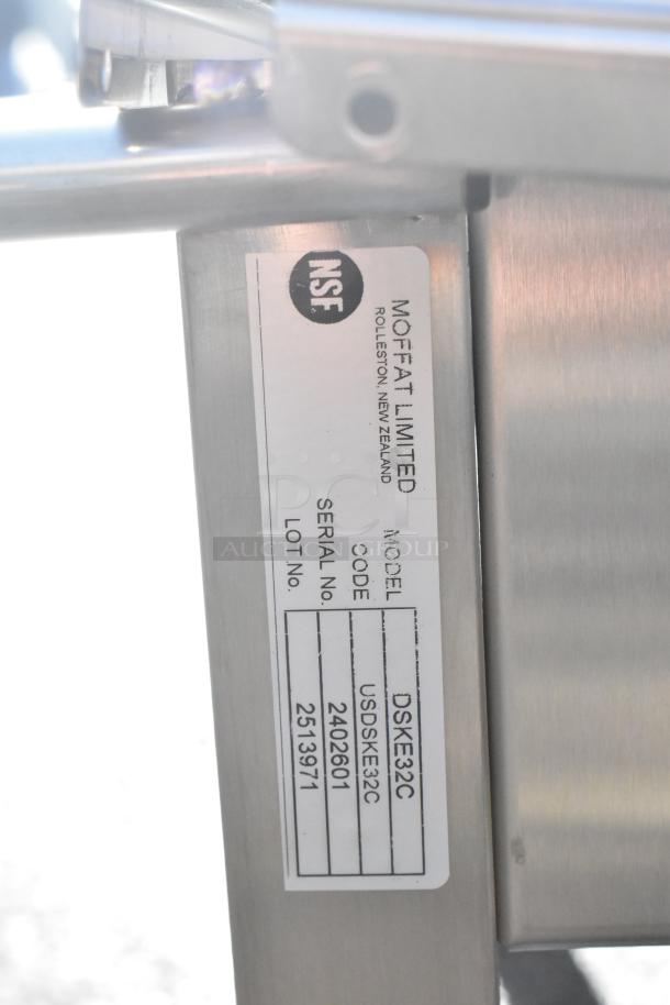 Moffat DSKE32C Dolly with commercial casters, stainless steel frame, NSF label, model and serial numbers visible.