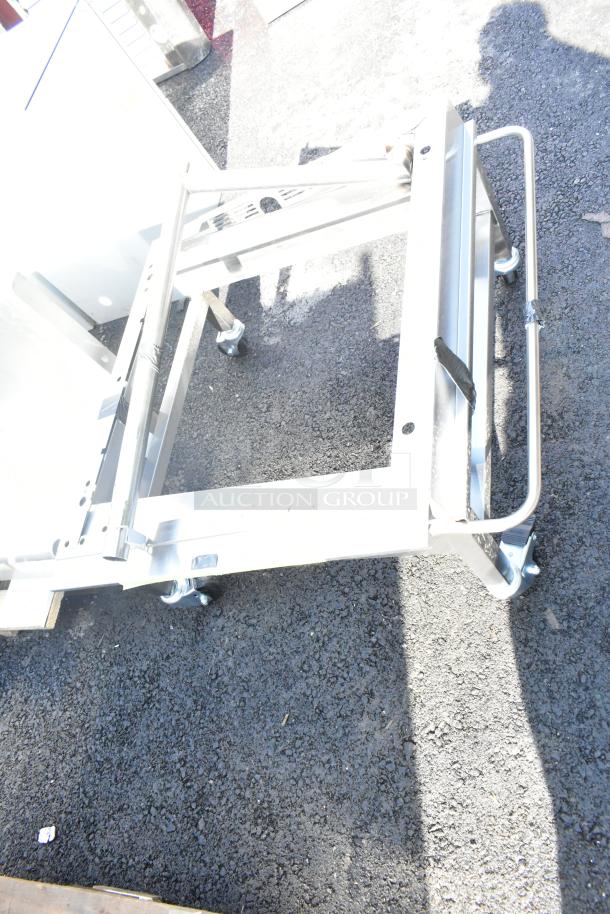 Moffat DSKE32C dolly on commercial casters, sturdy metal frame, gently used condition, suitable for heavy equipment.