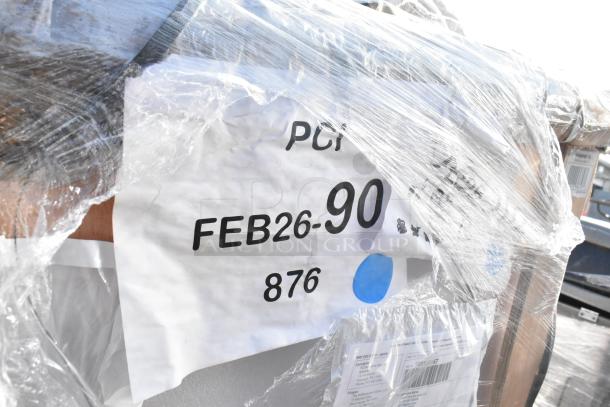 Packed pallet with four brand new scratch and dent items, labeled FEB26-90, wrapped in clear plastic for auction.