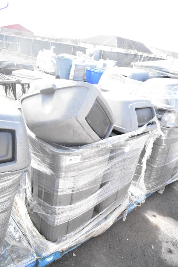 3 Toter gray poly trash can shells, wrapped on a pallet, in excellent condition. Ideal for bulk storage or disposal.