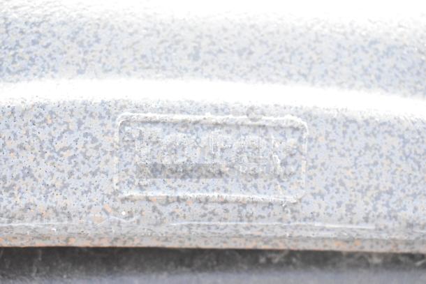 Toter gray poly trash can shell, visible brand marking, durable construction, used condition.