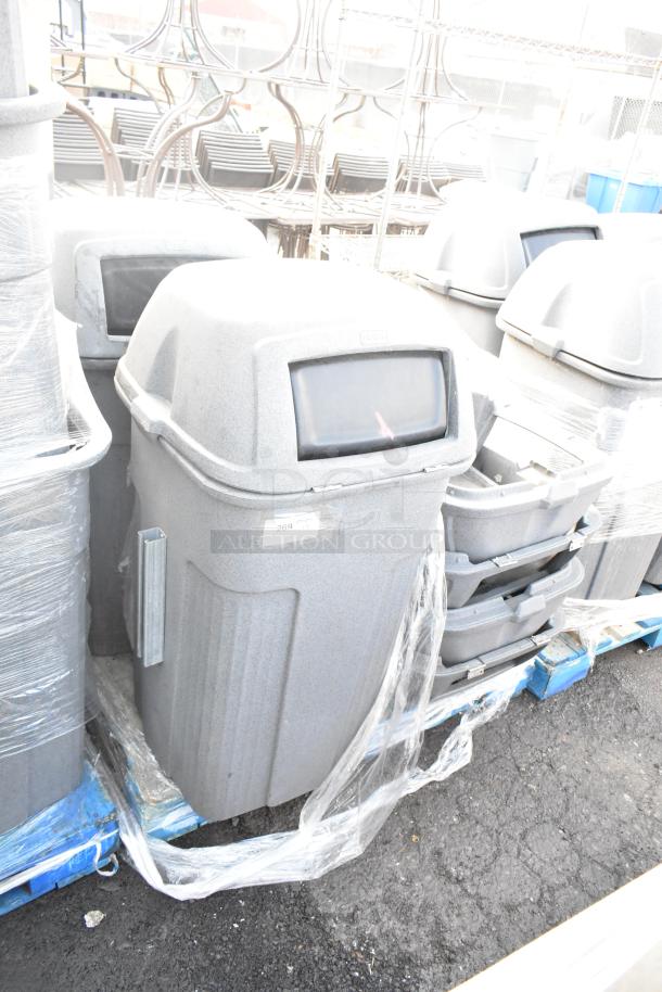 Gray Toter poly trash can shell, durable plastic, lid included. Auction lot of 9, moderate condition, stackable design.