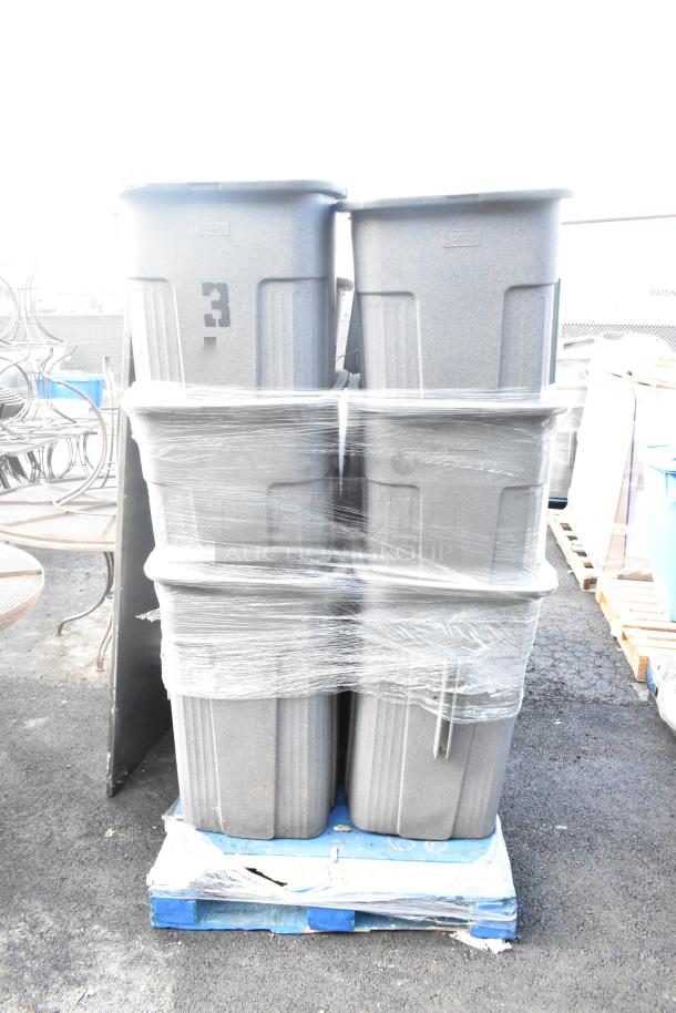 12 Toter gray poly trash can shells wrapped on a pallet. Sturdy design, marked with the number "3". Auction lot of 12.