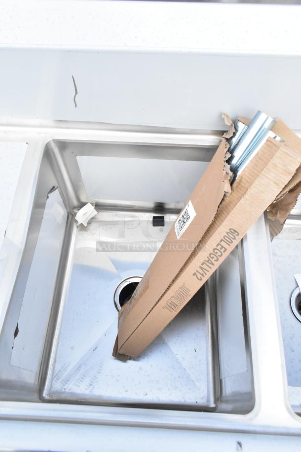 Brand new Regency 600S31620218 88" stainless steel sink, three compartments, galvanized legs, two drainboards, scratch and dent condition.