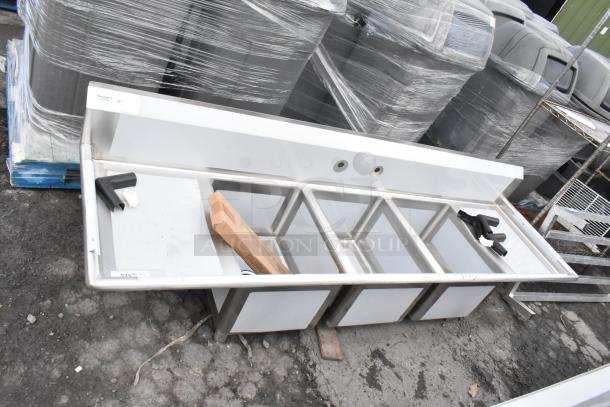 Brand new Regency 88" 16 gauge stainless steel three-compartment sink with galvanized legs, two drainboards, and labeled as scratch and dent.