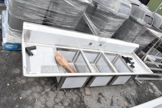 Brand new Regency 88" 16 gauge stainless steel three-compartment sink with galvanized legs, two drainboards, and labeled as scratch and dent.