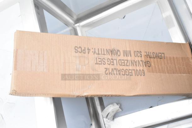 Brand new Regency 600S31620218 88" stainless steel three-compartment sink with galvanized legs and 2 drainboards, in box.