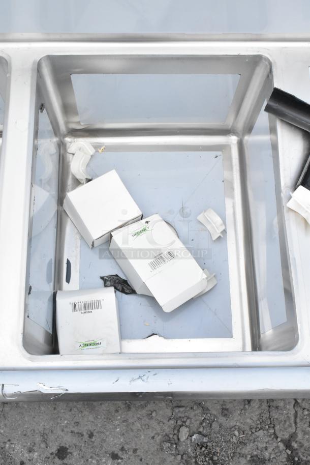 BRAND NEW SCRATCH AND DENT Regency 600S31620218 commercial sink with 3 compartments, galvanized legs, and drainboards.