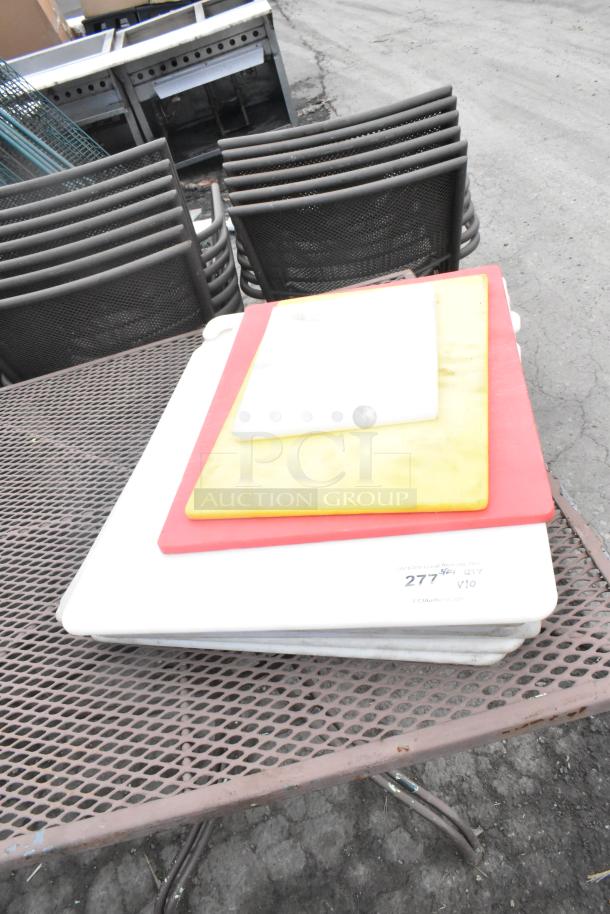 10 assorted cutting boards, various colors and sizes, used condition, auction tag "Qty 10", enhancing bid value.