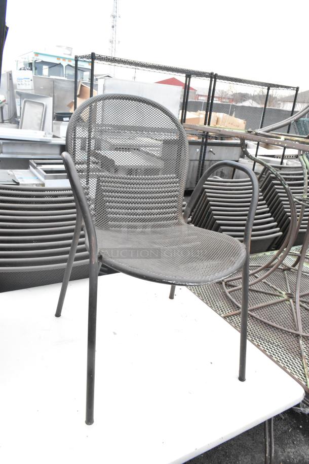 Metal mesh dining height chair, sturdy design. Features stacked for storage. Part of a lot with dining table and folding table.